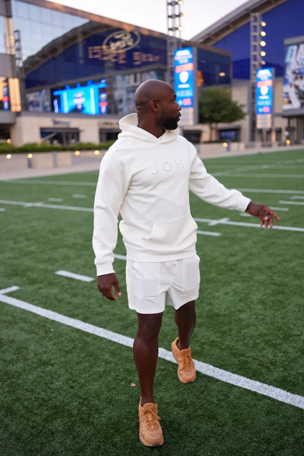 Out in the world in a bone JOH hoodie and shorts